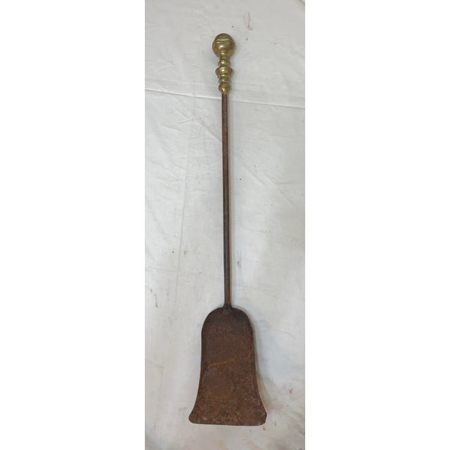 Up for sale is a rare antique 18th century wrought iron and brass English fireplace shovel. The shaft and blade are...