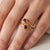Embrace modern elegance with a twist of classic romance. This exquisite open bypass ring features two brilliant, round-cut...