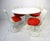 A very well crafted and iconic Mid Century white tulip table with four matching swiveling side chairs reupholstered in red...