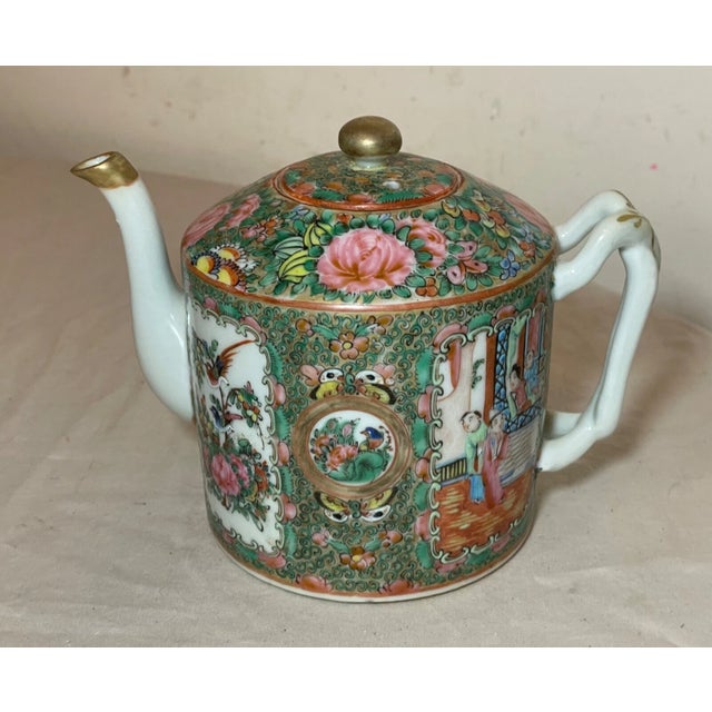 This antique teapot is a beautiful piece of Chinese export rose medallion porcelain. It is made out of white porcelain and...