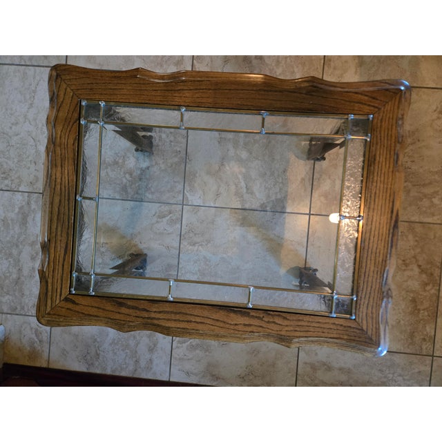 Victorian oak side table with ball and claw feet and leaded glass top with etched leaf border.