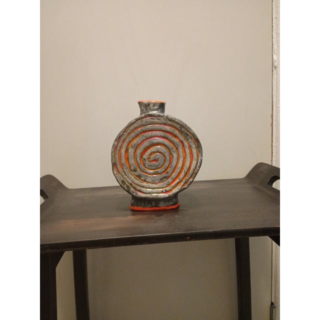 Intervention No. 15" is a captivating studio ceramic work that explores the tension between natural form and artificial...