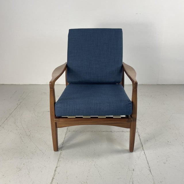 Beautiful curved armchair designed by Zenon Baczyk for Swarzedz of Poland. Solid stained beech, with curved arms. This...