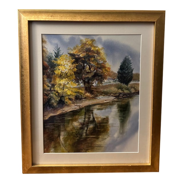 This beautiful watercolor landscape of a river shore is signed L. Hansen. It was professionally framed at Northwest Art...