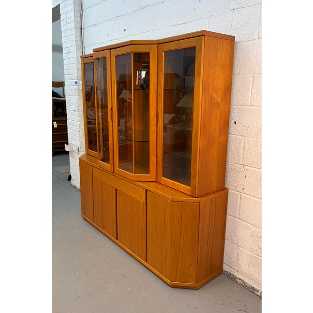 Bring timeless Mid-Century Modern style and practical storage into your home with this vintage teak buffet hutch by Design...