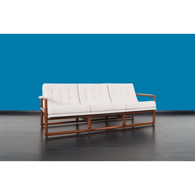 Mid century "Cube" sofa designed by Milo Baughman, circa 1970s. Solid oak frame refinished in a walnut tone. Tufted scoop...