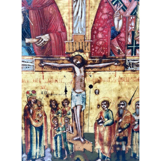 Traditional Russian icon made in the 18th century, depicting the crucifixion of Jesus who is surrounded by various saints...