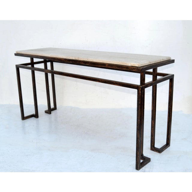 Restoration Hardware Minimalist Console Table in Steel with floating Travertine top. The Steel has a black & bronze finish...