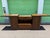 Authentic Marge Carson-Versatile wooden sideboard has a central marble top and two flip-top side panels with textured...