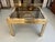 Elegant vintage coffee table or side table in chromed metal, brass and glass.