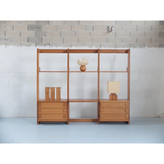 Adjustable height shelving, adjustable chests of drawers. This piece has an attribution mark, I am sure that it is...