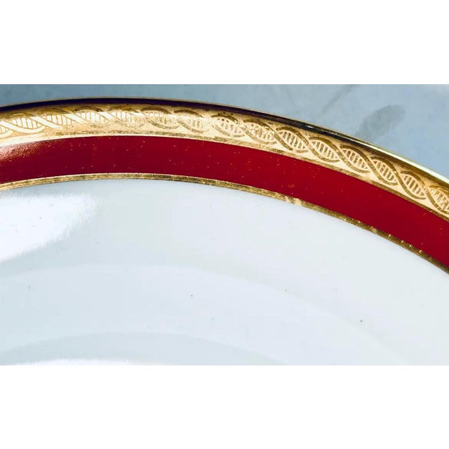 Set of ten discontinued pattern by Richard Ginori Palermo rust butter plates banded in a deep orange and outside etched...