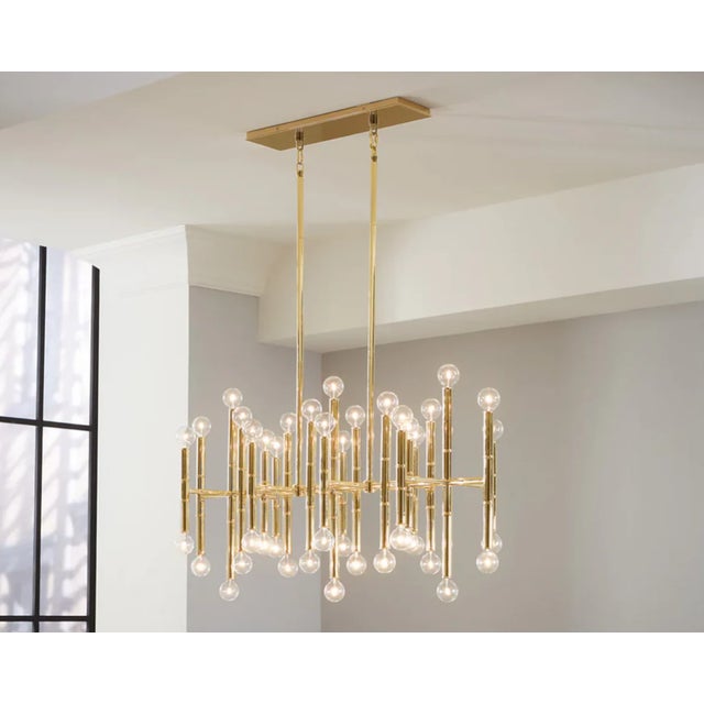 A bold reinterpretation of classic bamboo, this sculptural 42-light rectangular chandelier blends iconic form with modern...