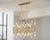 A bold reinterpretation of classic bamboo, this sculptural 42-light rectangular chandelier blends iconic form with modern...