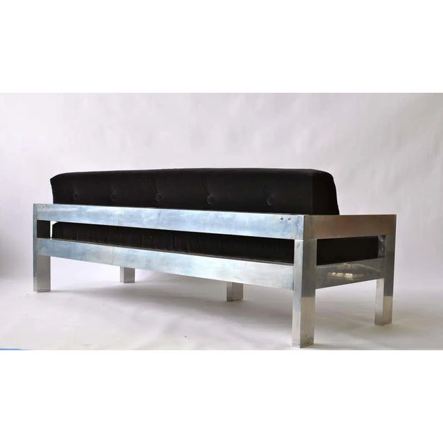1970s polished aluminum frame sofa. Newly upholstered black velvet.