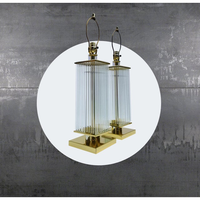 This pair of Sciolari lamps provide a glamorous ambience to your elegant space. Glass rods "flow" like a waterfall from...