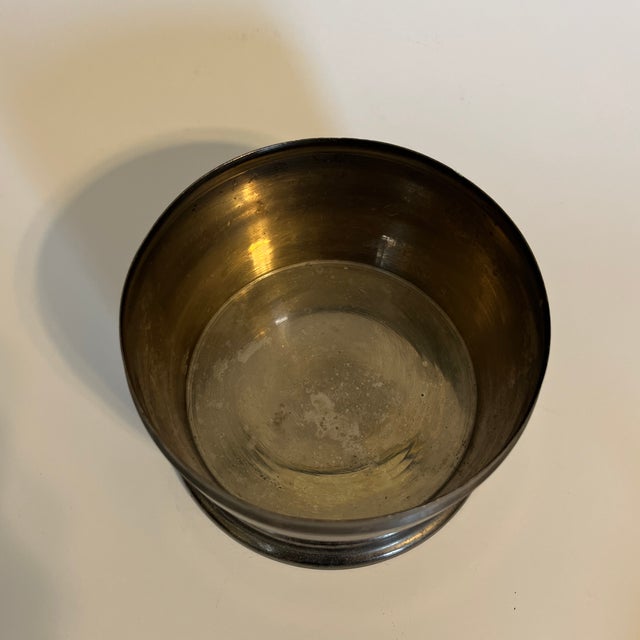 Silver plated biscuit or candy tin. slightly tarnished, good condition. Sticker on the bottom states, "Made in India".