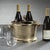 Kenneth Ludwig Chicago Aluminum Three Bottle Wine Holder- Gold Keep your wine cool and stylish with our Raw Aluminum Three...