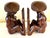 Mid Century pair of beautifully hand carved wood bookends of a tribal man and woman, with a rich brown sheen, probably...