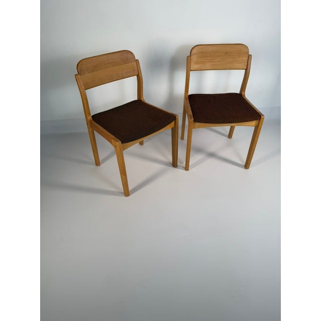 Original pair of Danish dining chairs designed by Henning Kjærnulf and manufactured by Vejle Møbelfabrik in Denmark....