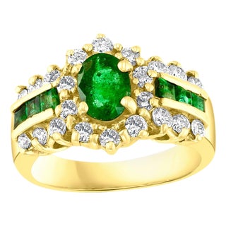 1 Carat Oval Cut Emerald and 1.0 Carat Diamond Ring 18 Karat Yellow Gold For Sale