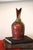 This unique piece is hand-made and one-of-a-kind! It consists of an earthenware bottle with a geometrically abstract...