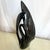 A striking vintage Art Deco ceramic sculpture by Haeger, finished in a deep glossy black glaze. This elegant swan form...