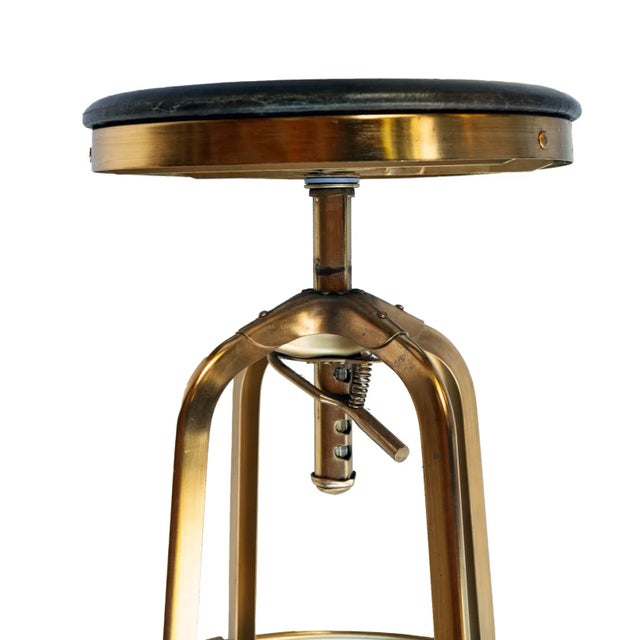 A Handsome Vintage Restoration Hardware Brass Plated Adjustable Stool with Brown Leather seat.