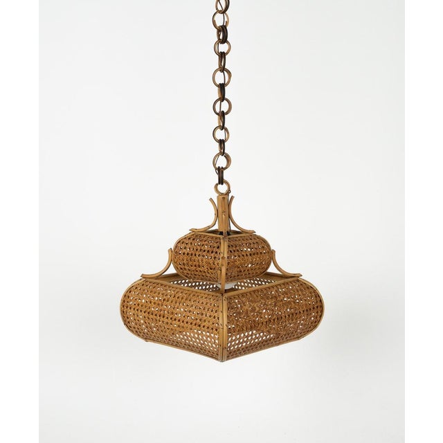 Midcentury beautiful hand-crafted chandelier in rattan and wicker with chain with round rattan links which can be...