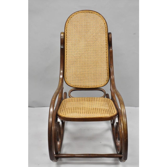 Vintage Mid Century Modern Thonet Style Bentwood & Cane Rocker Rocking Chair (B). Circa Mid 20th Century. Measurements:...