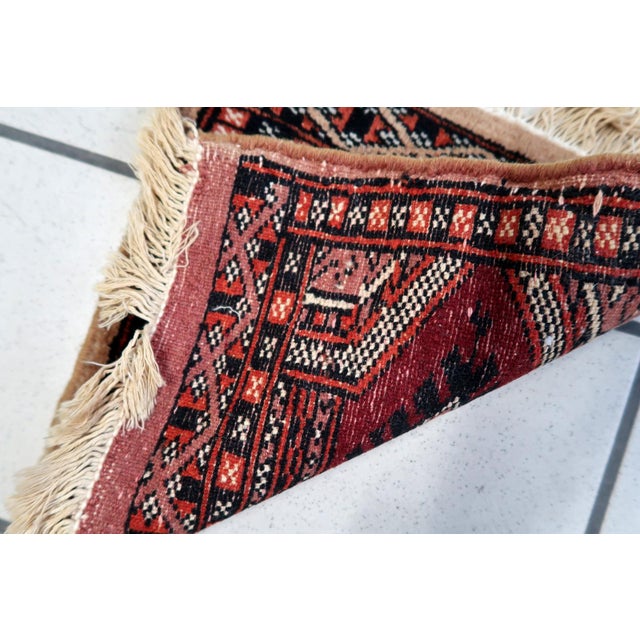 Handmade Vintage Uzbek Bukhara Mat Rug: Delve into the intricate craftsmanship of Uzbekistan with our Handmade Vintage...