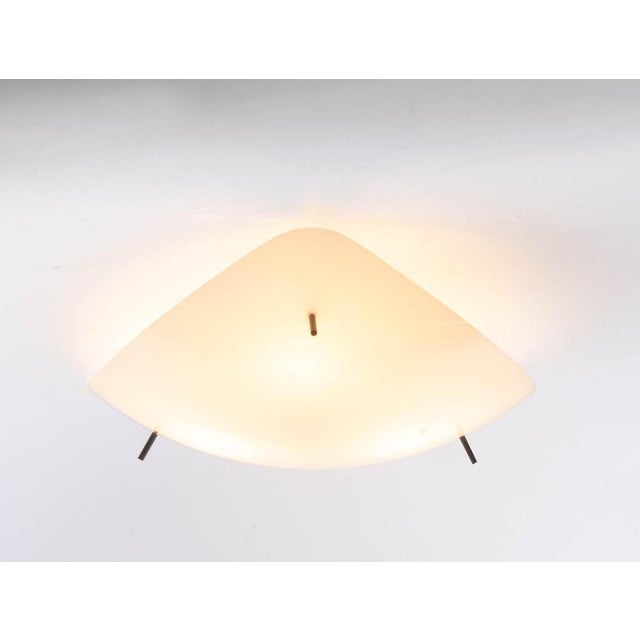 Mid century flush mount designed by gino sarfatti attr. For arteluce. The ceiling fixture is made of a white plastic...