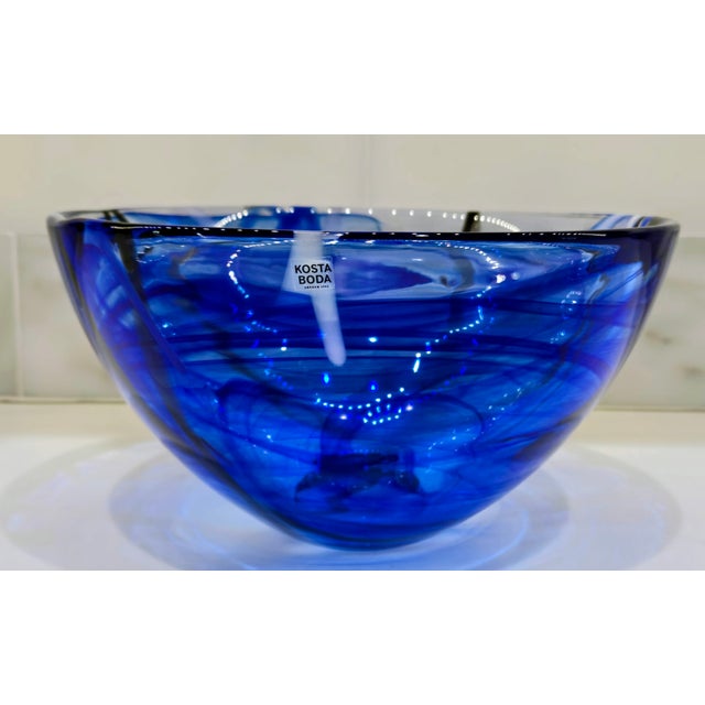 Striking Kosta Boda Contrast art glass bowl in vivid cobalt and ice blue, designed by Swedish artist Anna Ehrner and...