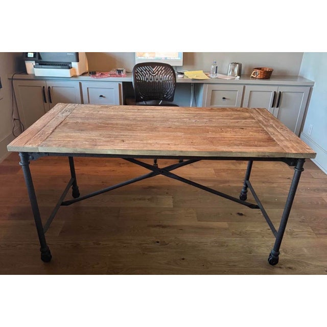 Tabletop is handcrafted of antiqued reclaimed elm on a wood frame Reclaimed Natural Elm finish is crafted from antique...