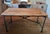 Tabletop is handcrafted of antiqued reclaimed elm on a wood frame Reclaimed Natural Elm finish is crafted from antique...