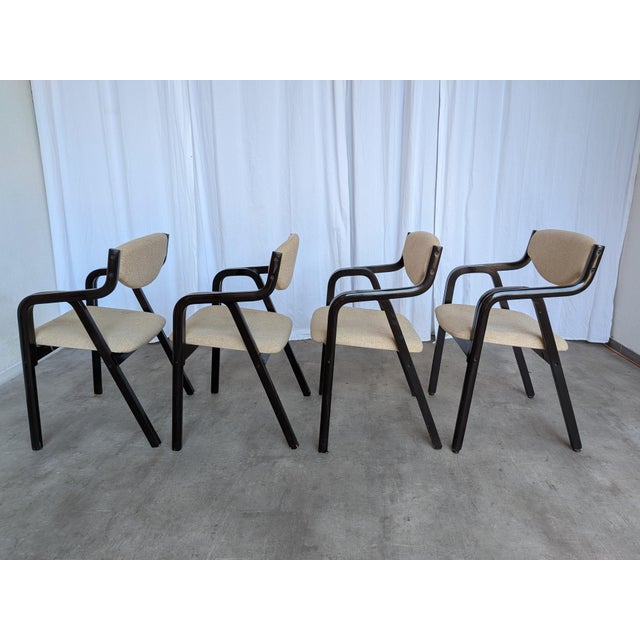 These vintage dining chairs were made back in the 1970s in former Yugoslavia. They are made from black wooden base in mid-...