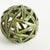 This contemporary little orb is made of thin ceramic strips giving it an open and airy feel. The dynamic, reactive glaze...