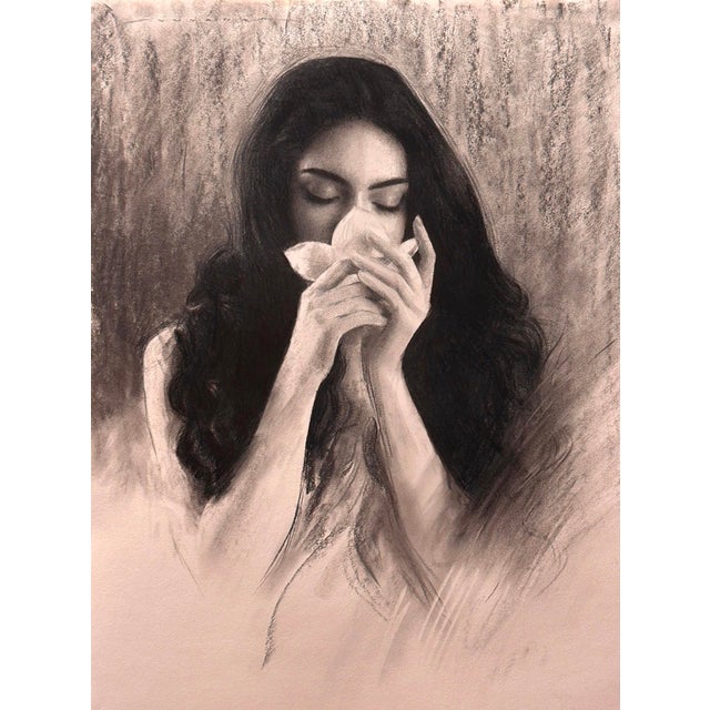This artwork features a figure gently holding a flower close to her face, exuding a sense of intimacy and contemplation....