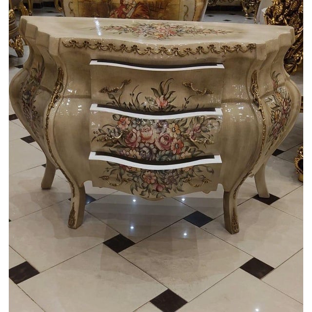 49.6 W x 19.7 D x 30.3 H This exceptional French Rococo piece showcases dramatic curved sides, a richly hand-finished...