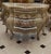 49.6 W x 19.7 D x 30.3 H This exceptional French Rococo piece showcases dramatic curved sides, a richly hand-finished...