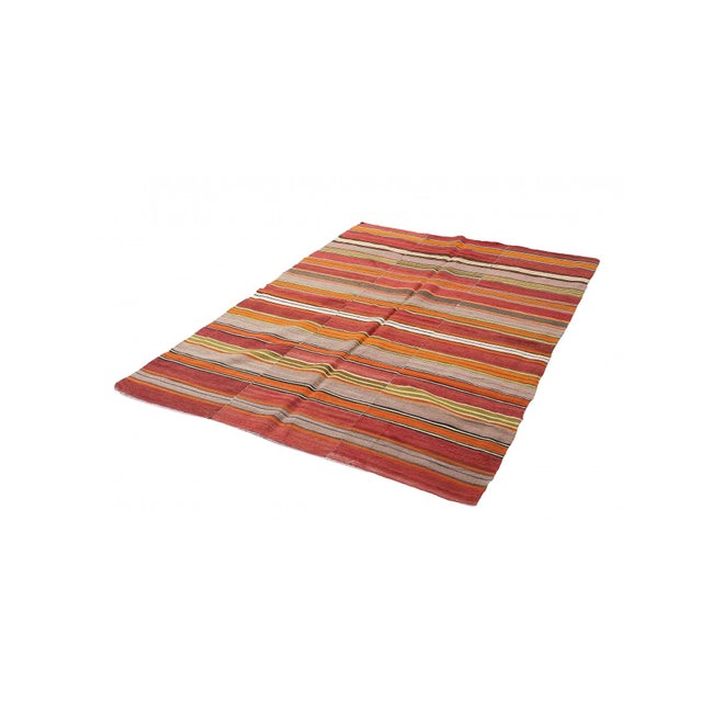 Handwoven vintage striped decorative kilim rug from Denizli region of Turkey. Approximately 50-60 years old. In very good...