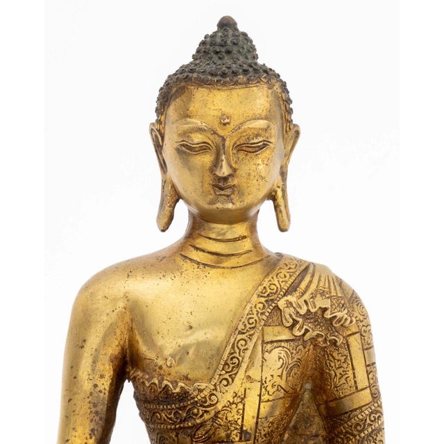 Chinese Tibetan Amitabha Gilt Bronze Sculpture, 19th century of earlier, the Buddha of Infinite Light and Life holding a...