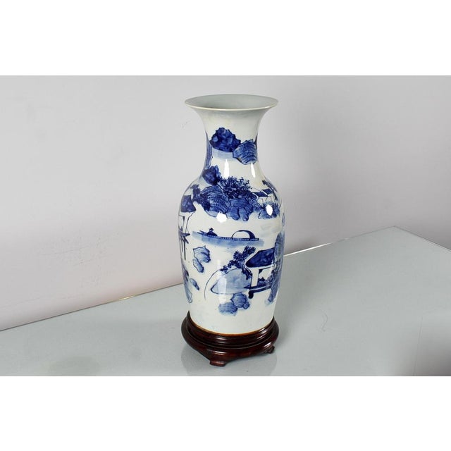 Asian art, hand-painted blue and white porcelain vase, depicting elements of nature and fishing scenes. China, presumably...
