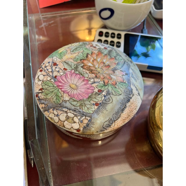 Up for consideration is a beautiful vintage floral ceramic round box. This would look lovely in your home and it is a...