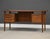 A mid century modern teak floating top desk designed by Peter Løvig Nielsen with a drawer with the capability for hanging...