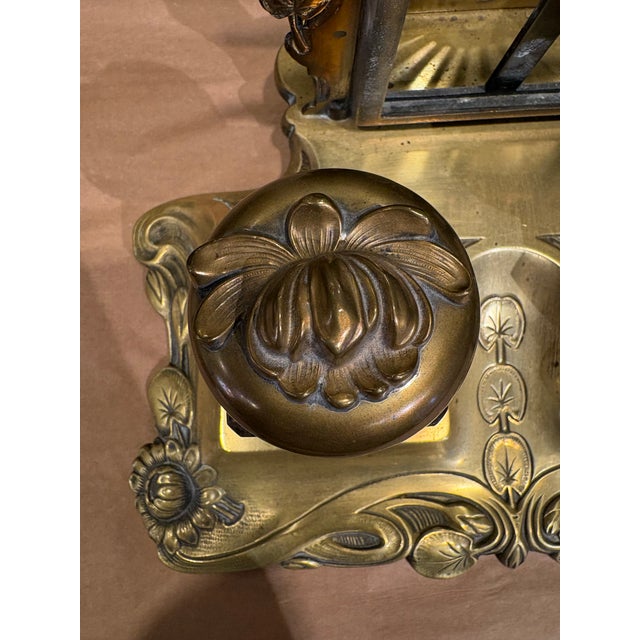 This is a beautiful antique double inkwell with a metal letter stand attached. The two inkwells are made of glass with...