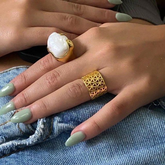 The Flower of Life Gold Adjustable Statement Ring is simple in design yet flashy. With the geometric design on a simple...