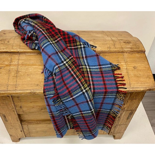 Merino Lambswool Knee Rug/Blanket In A Colorful Blue Plaid Pattern- Made In England. Our knee blankets are cut to a...
