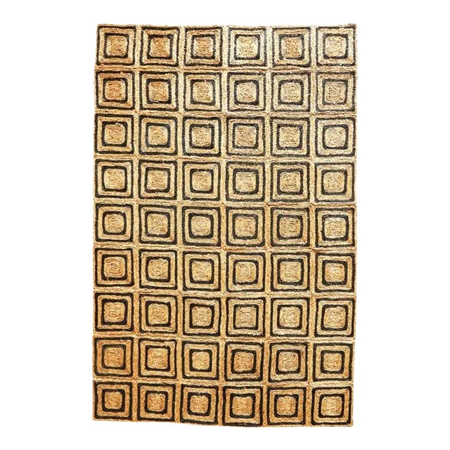 This handmade seagrass rug is woven in a striking pattern of one-foot black-and-natural squares. It's easily tailored to...