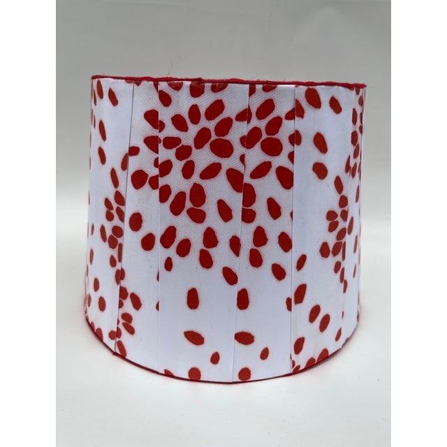 A single round tapered drum shape box pleat paper lamp shade featuring the “Fireworks” pattern by Albert Hadley for Hinson...